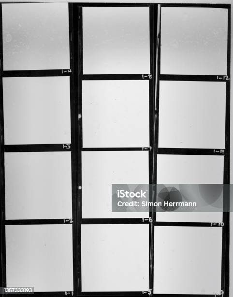 Real Flat Bed Scan Of Black And White Hand Copy Contact Sheet With 12 Empty Film Frames Stock Photo - Download Image Now