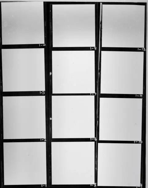Photo of real flat bed scan of black and white hand copy contact sheet with 12 empty film frames