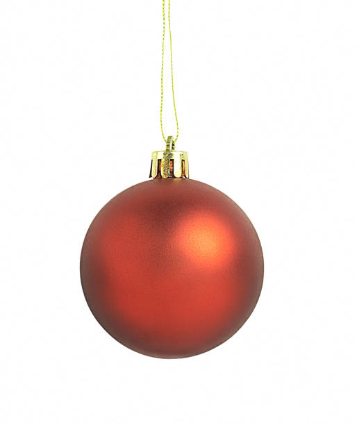istock Hanging red Christmas ball isolated on white 1357333478