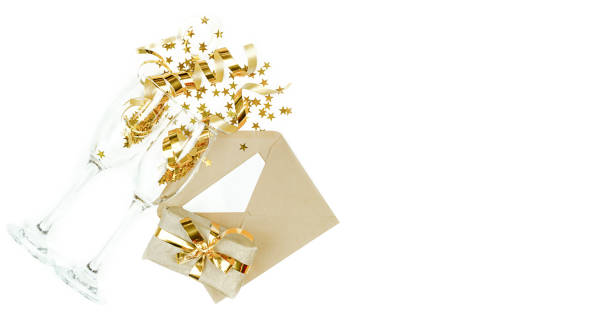 istock A composition of glasses, a gift, a letter with a Christmas decor. Top view. 1357333493