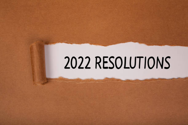 istock Torn Paper With New Year 2022 Resolutions On White Background 1357334201
