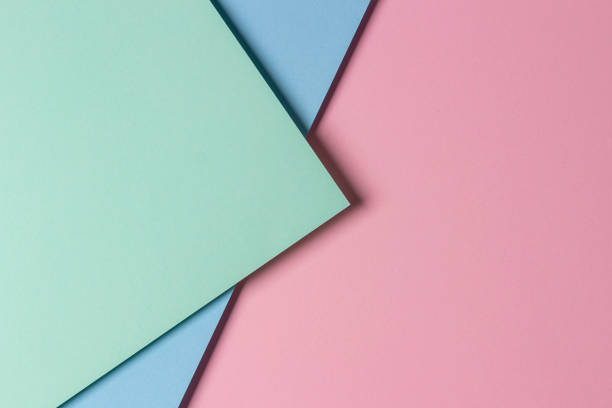 istock Abstract creative geometric pastel pink, light green and blue paper background with copy space 1357334316