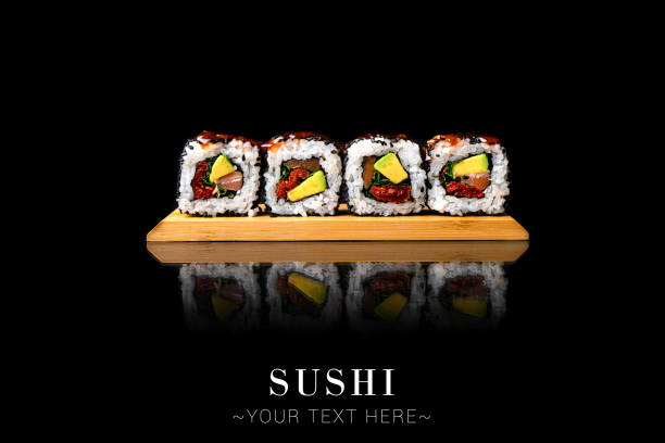 istock Salmon sushi roll with reflection isolated on black background ready food banner with text space 1357335590