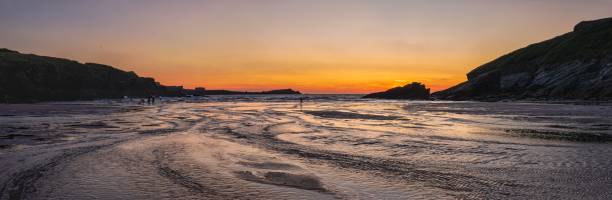 istock Sunset during low tide in Porth Beach, Newquay, Cornwall, England 1357336098