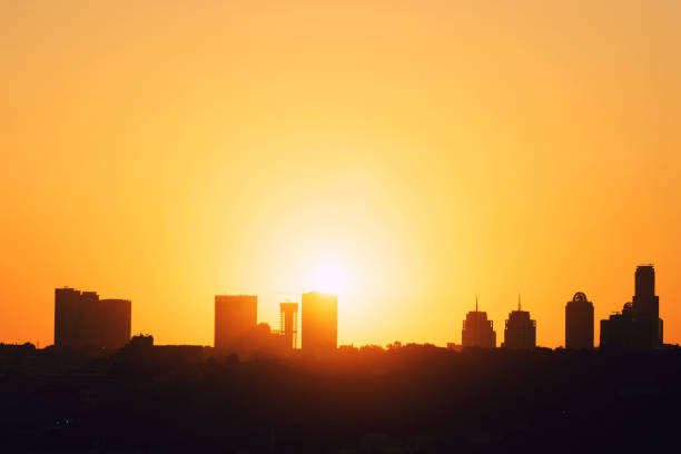 Sunset behind buildings in istanbul. Building silhouettes.