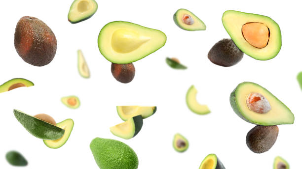 istock Fresh ripe avocados falling on white background, banner design 1357341928
