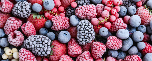 istock Mix of different frozen berries as background, banner design 1357343265