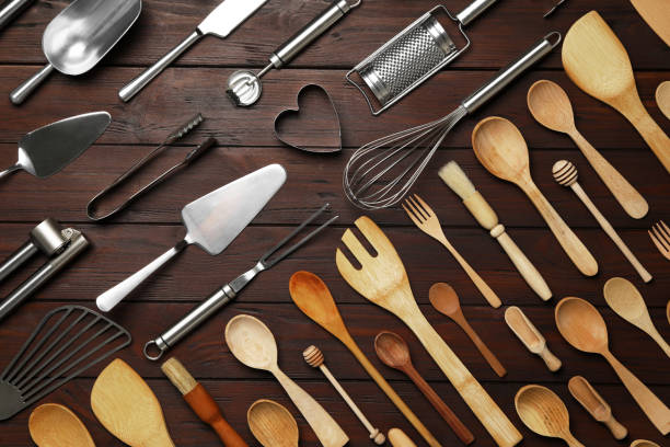 istock Set of modern cooking utensils on brown wooden table, flat lay 1357346042