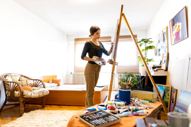 istock Young painter creates in her studio at home stock photo 1357350895