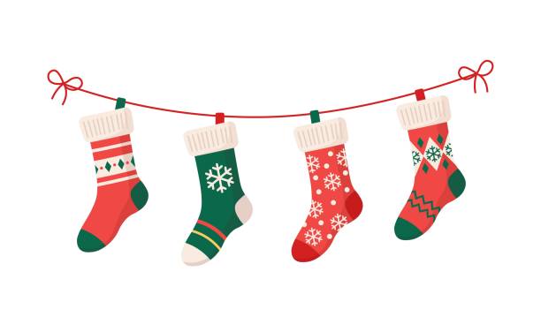Christmas stockings with various traditional colorful holiday ornaments. Christmas stockings with various traditional colorful holiday ornaments. Hanging children clothing elements with cute xmas patterns on rope. Red, green socks with snowflakes, snowman, christmas tree. Vector christmas stocking stock illustrations