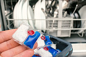 putting tablet detergent in the dishwasher detergent section