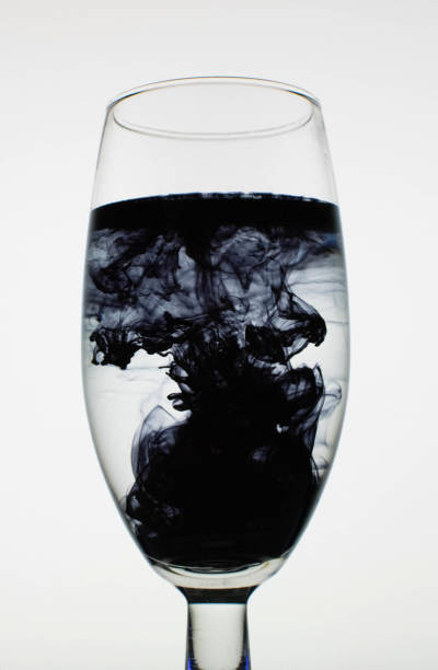 a fantastic wallpaper of ink in glass stock photo