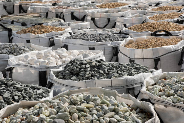 A lot of one cubic meter bags filled with variations of garden decorative crushed stones in the Hardware Store. A lot of one cubic meter bags filled with variations of garden decorative crushed stones in the Hardware Store. boundary stone stock pictures, royalty-free photos & images