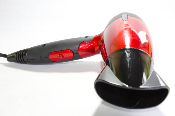 istock Red hair dryer with white background 1357360635