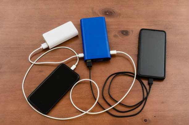 istock Charge sharing: recharging two cellphones combining two power banks 1357363281