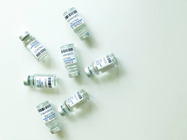 istock Unorganized COVID-19 vaccines over a white table 1357364819