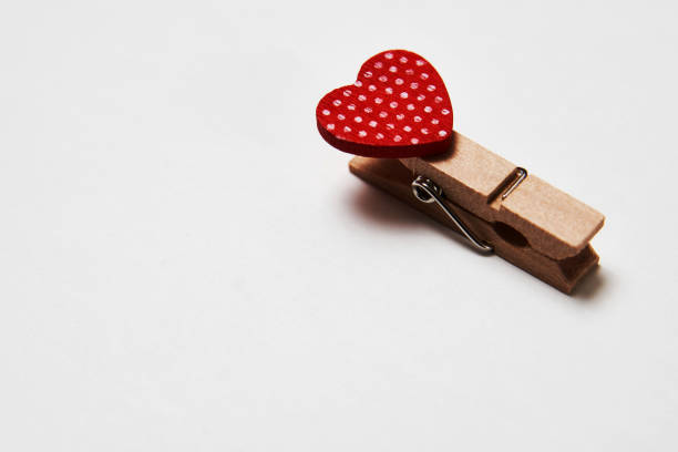 istock Clothespin with red heart on a white background 1357370046