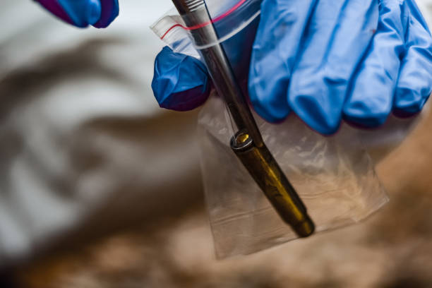 istock Forensic scientist on a crime scene collecting evidence 1357370716