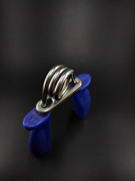 istock Hand grip device on black - stock photo 1357374765
