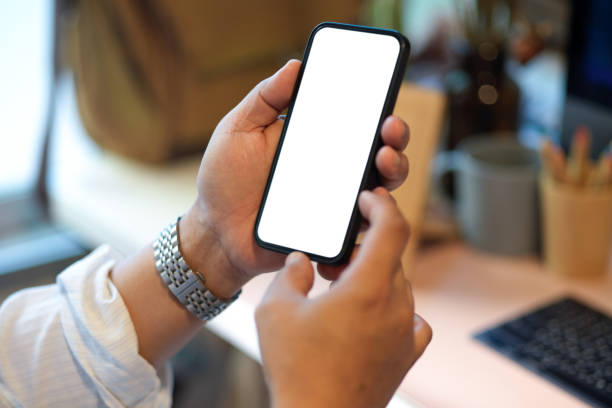 istock Businessman holding smartphone, using smartphone 1357376995
