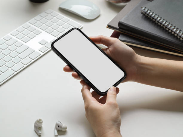 istock Businesswoman hands using smartphone mockup 1357377003