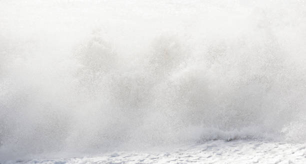 istock big waves breaking on the shore, with white foam 1357377042