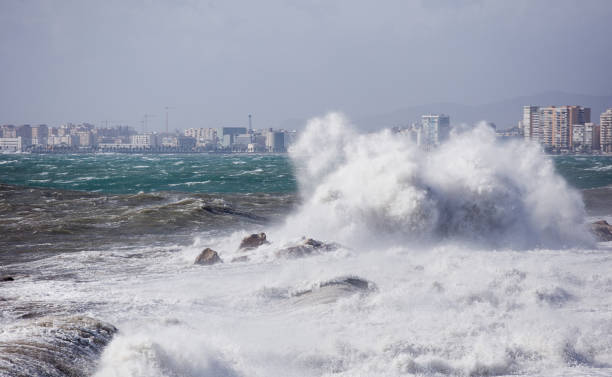 istock big waves breaking on the shore, with white foam 1357377045