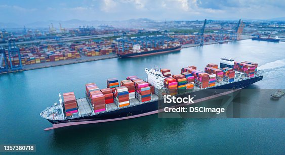 istock Aerial top view containers ship cargo business commercial trade logistic and transportation of international import export by container frieght cargo ship in the open seaport. 1357380718
