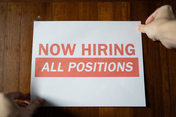 istock Now hiring sign on the wall 1357385355