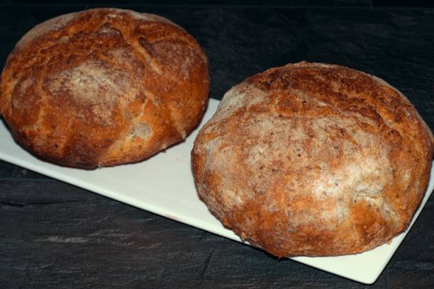 istock Two rolls of freshly baked unleavened bread. 1357391736