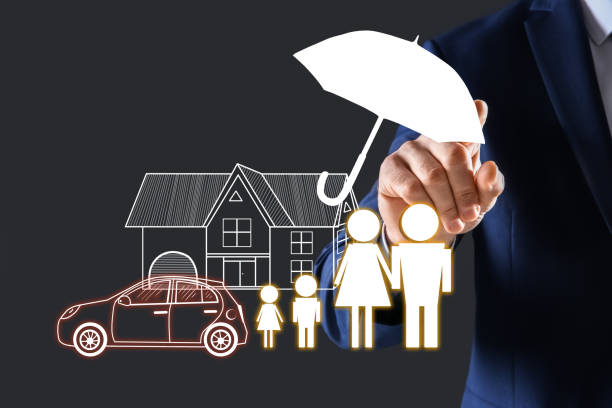 istock Insurance concept - umbrella demonstrating protection. Man using virtual screen with illustrations, closeup 1357396521