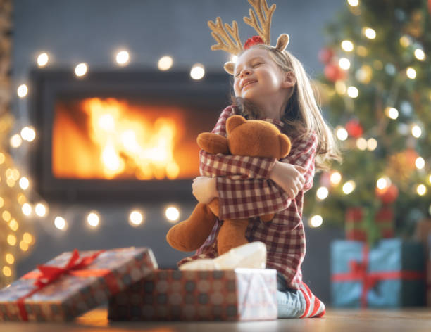 istock girl with Christmas gift 1357396648
