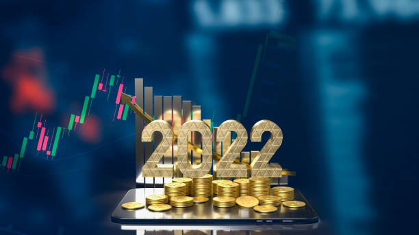 istock The 2022 gold text business chart and gold coins on tablet 3d rendering 1357397686
