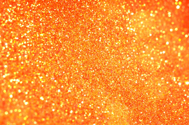 Abstract orange background with sequins