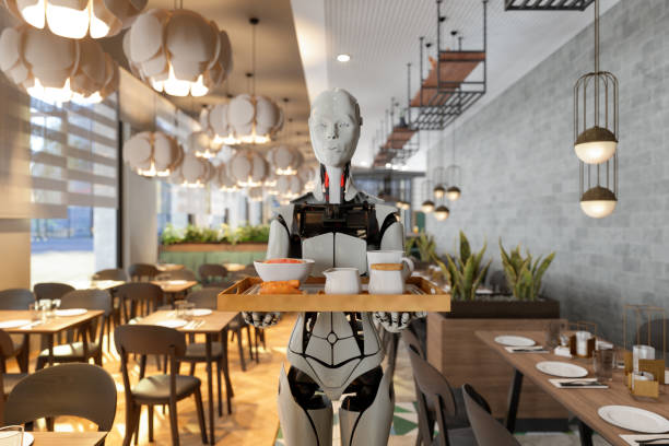 istock Robot Waiter Serving Food And Drink In A Restaurant 1357398655