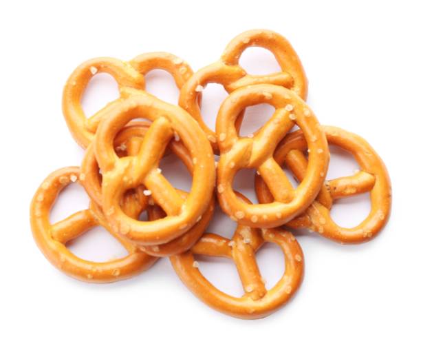 istock Delicious crispy pretzel crackers isolated on white, top view 1357398684