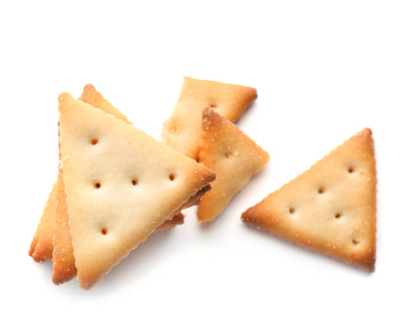 istock Delicious crispy crackers isolated on white, top view 1357399357