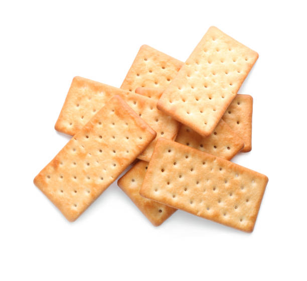 istock Delicious crispy crackers isolated on white, top view 1357399585