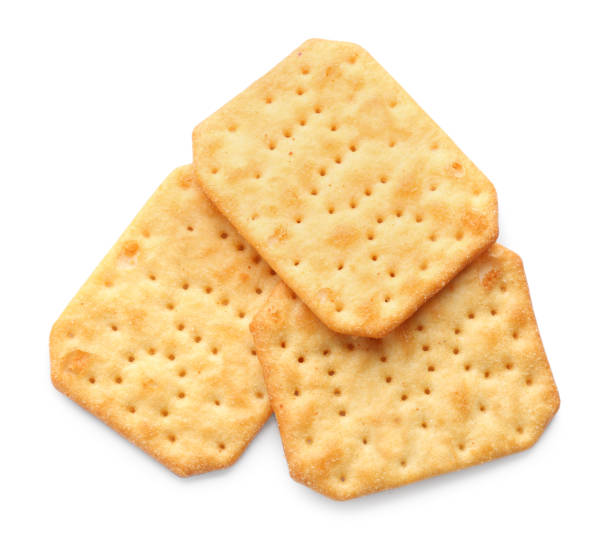 istock Delicious crispy crackers isolated on white, top view 1357400180