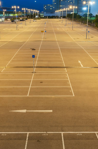 istock empty car park with urban background at night 1357401482