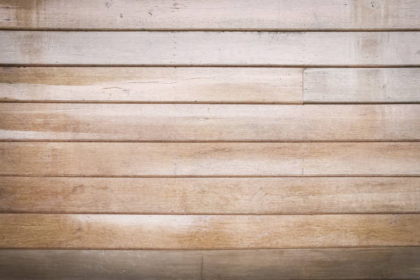 istock Wooden plank wall with horizontal patterns for light brown background 1357401528