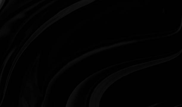 istock Black gray satin dark fabric texture luxurious shiny that is abstract silk cloth background with patterns soft waves blur beautiful. 1357401605