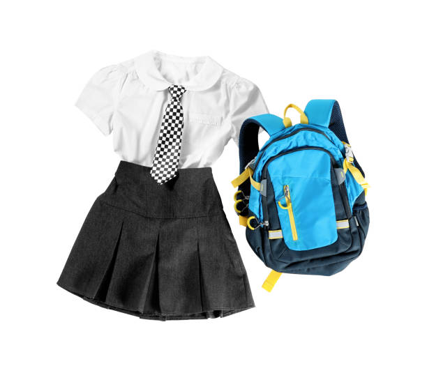 istock Stylish school uniform for girl and backpack on white background, top view 1357401771
