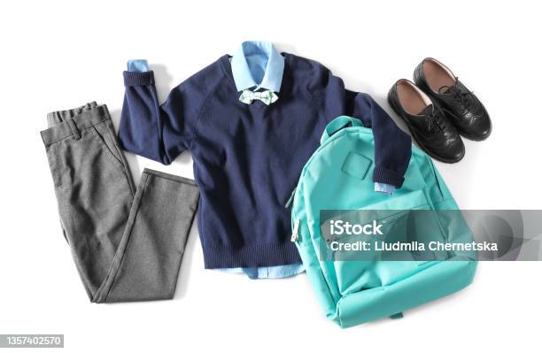 Stylish School Uniform For Boy And Backpack On White Background Top View Stock Photo - Download Image Now