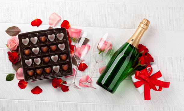 istock Champagne bottle and heart candy 1357404100