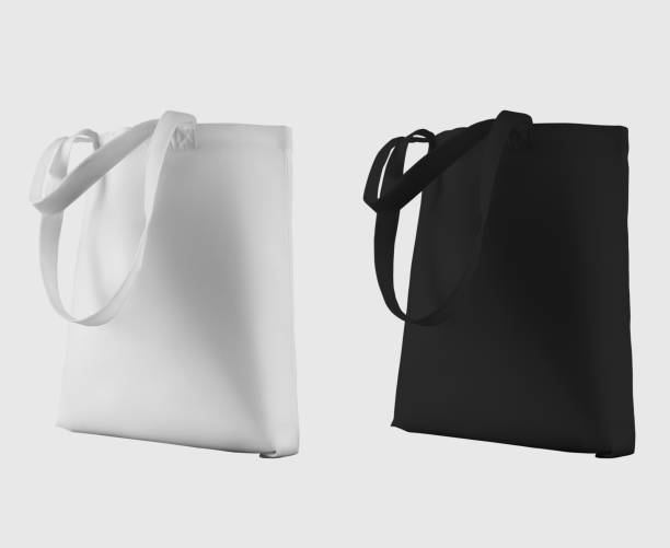 istock Mock up of white, black totebag 3d rendering, ecobag with shopping handle, isolated on background. Set 1357406570