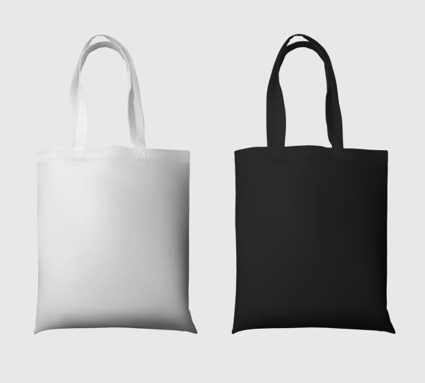 istock Mock up of white, black totebag 3d rendering, ecobag with shopping handle, isolated on background. Set 1357406579