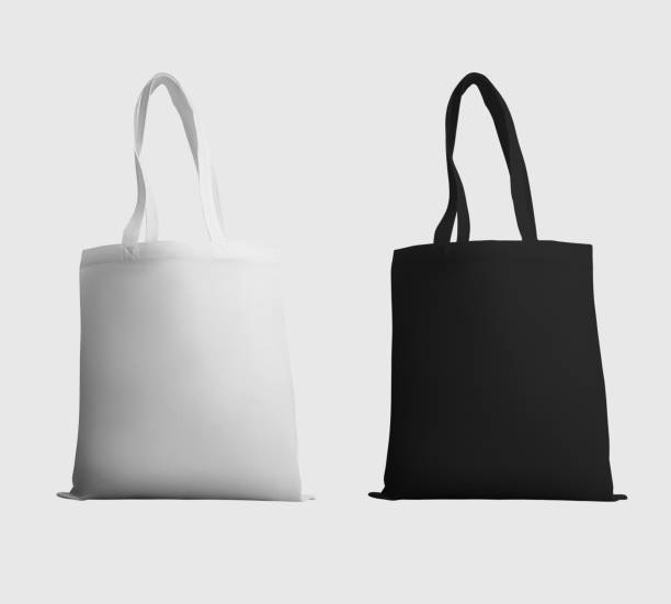 istock Mock up of white, black totebag 3d rendering, ecobag with shopping handle, isolated on background. Set 1357406598