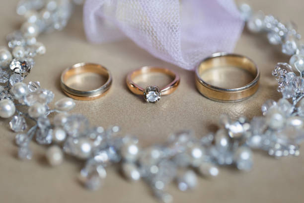 istock Wedding rings and necklace. Wedding accessories. 1357406668