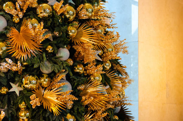 istock Golden and silver color baubles decorated on Christmas tree. 1357406691